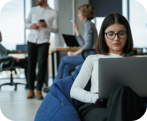 smart-woman-is-sitting-and-uses-laptop-people-are-2024-02-29-22-12-56-utc (2)